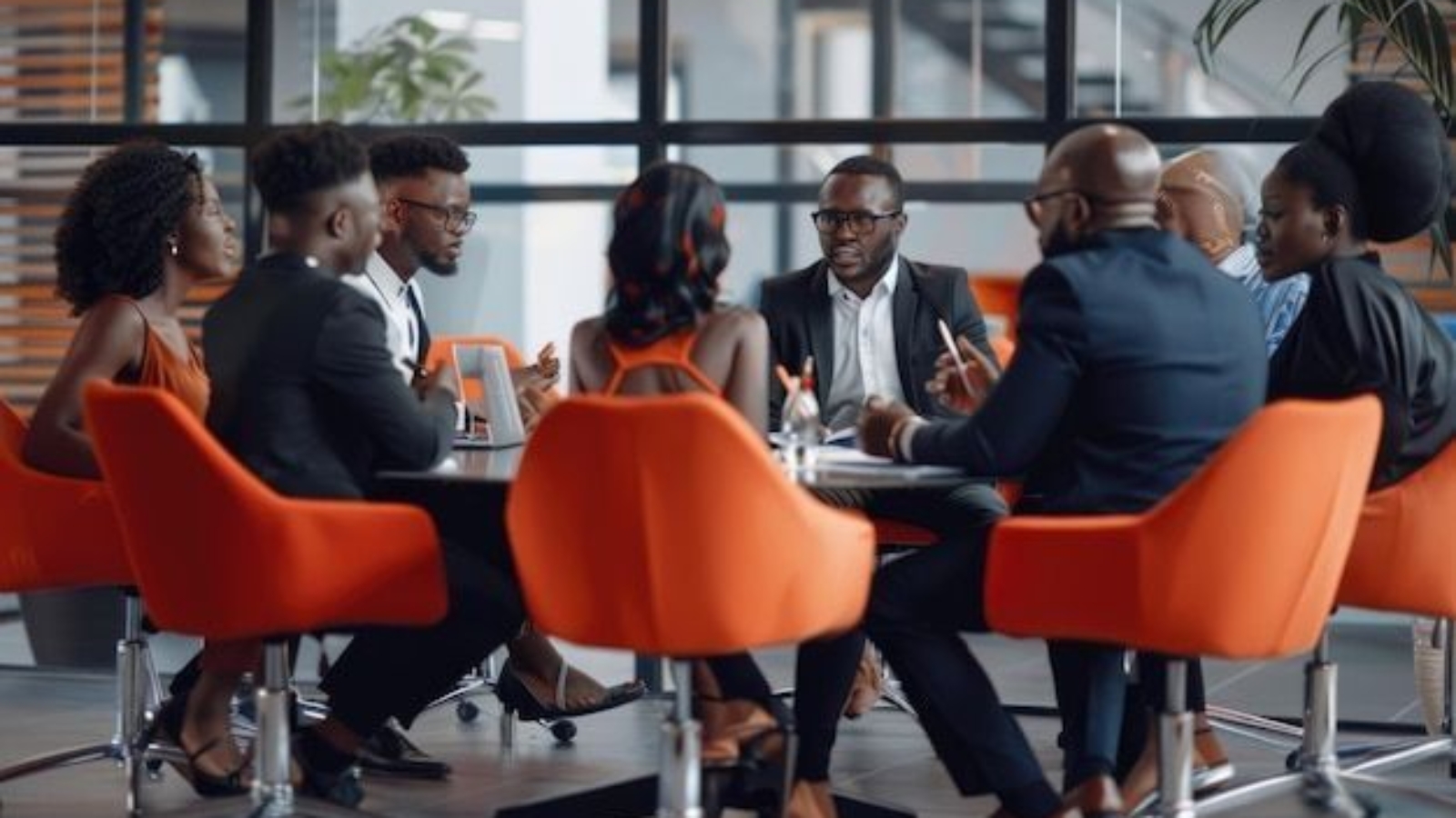 Team-of-african-bussines-people-sitting-in-a-modern-office-and-talking-during-an-work-meeting-_-P___