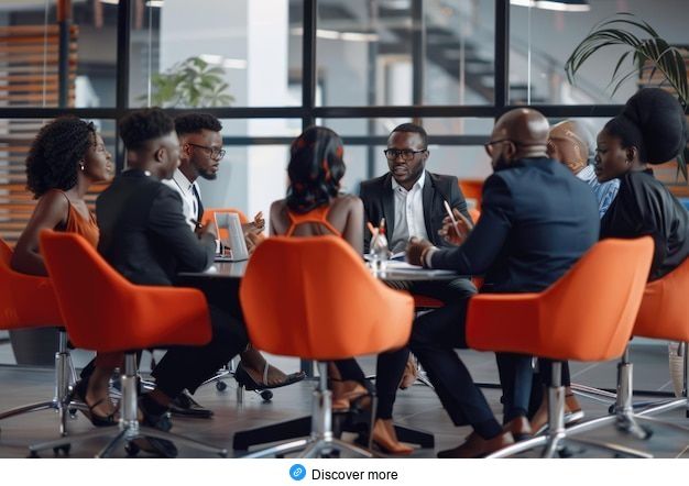 Team-of-african-bussines-people-sitting-in-a-modern-office-and-talking-during-an-work-meeting-_-P___